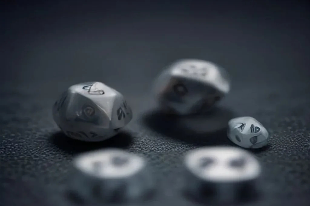 A pair of plain dice blurred in motion above a dark reflective surface